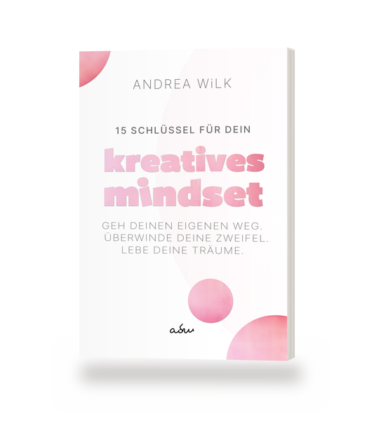 Taschenbuch »15 Schlüssel für dein Kreatives Mindset« von ANDREA WiLK, stehendes Buch mit Blick auf Cover und Buchblock.